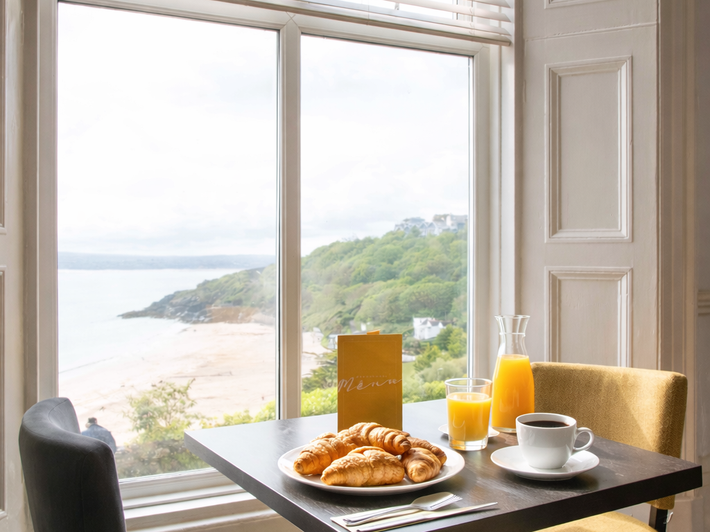 Breakfast on table looking out to sea